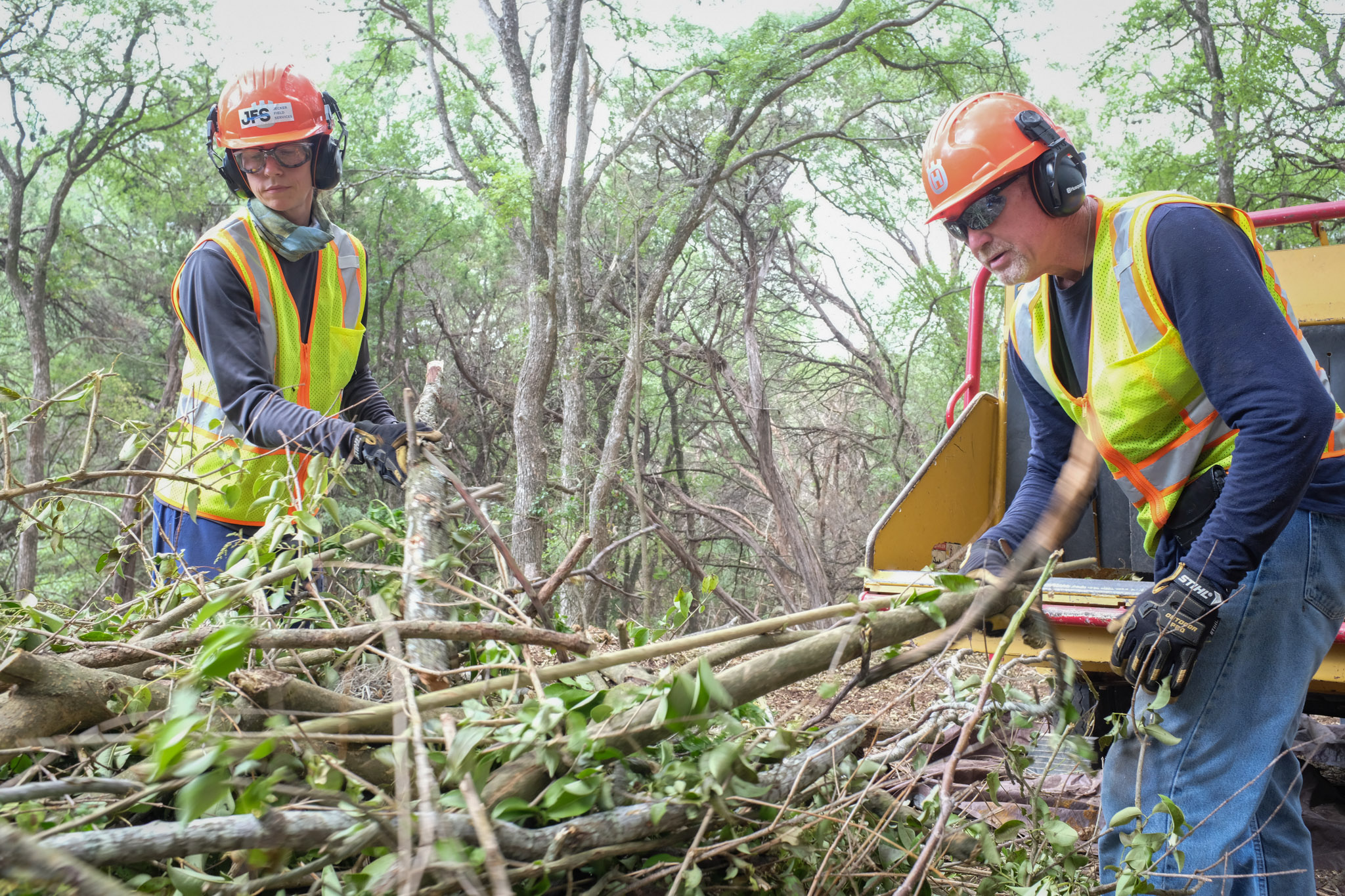Jecker Field Services crew clearing brush and limbs